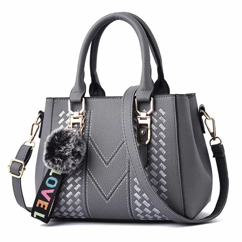 Amelia™ - Bolsa mensageiro bordada