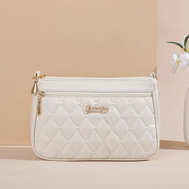 Lily™ - Bolsa mensageiro bordada