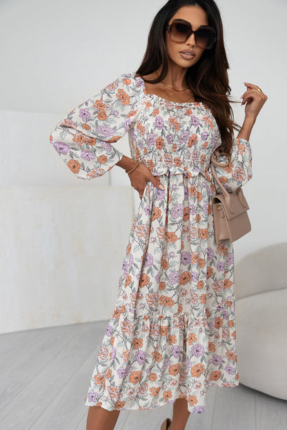 Vestido com bolsos e manga comprida com babados florais