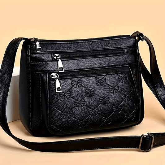 Bolsa acolchoada crossbody - couro sintético, cor sólida, enfeite de borla, fecho de zíper